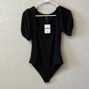 black bodysuit puff sleeve.  never worn.